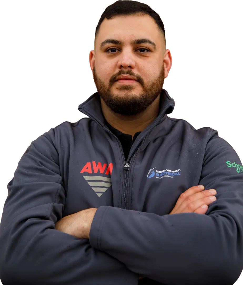 Man in branded jacket, arms crossed.